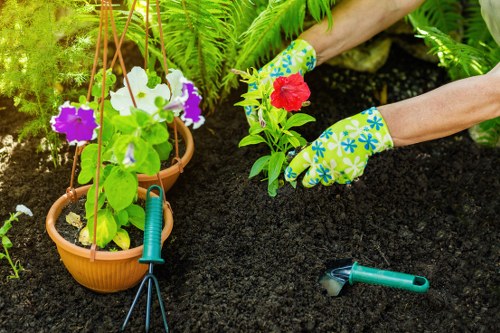 Gardener wearing protective equipment during outdoor maintenance